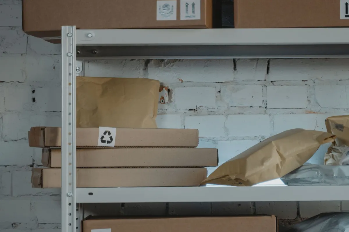 Packed cartons on steel shelves in a storage warehouse